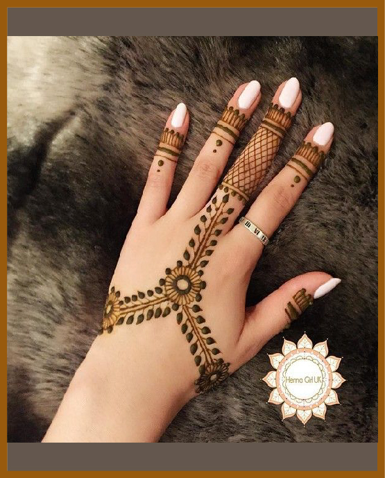 Artistic khafif back hand mehndi with minimal fill