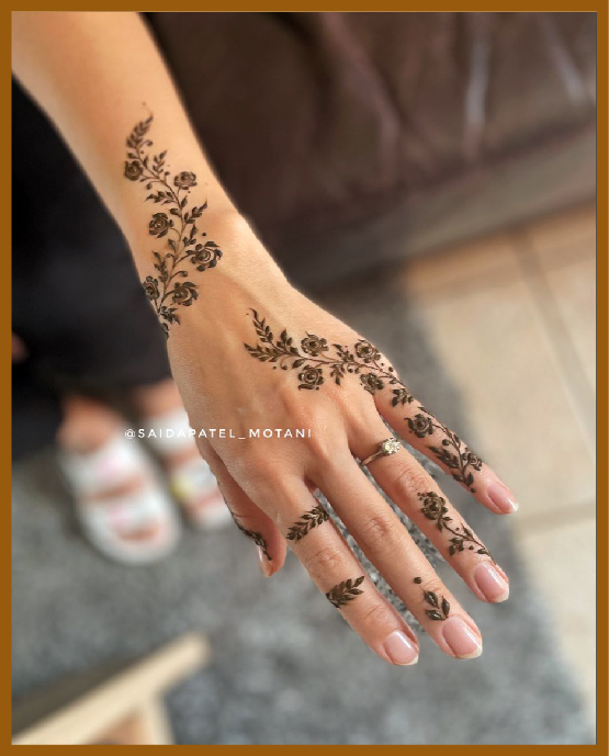 Elegant khafif back hand mehndi design with floral vines