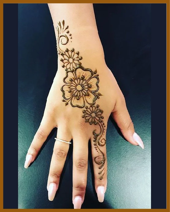 Flower band across khafif back hand mehndi design