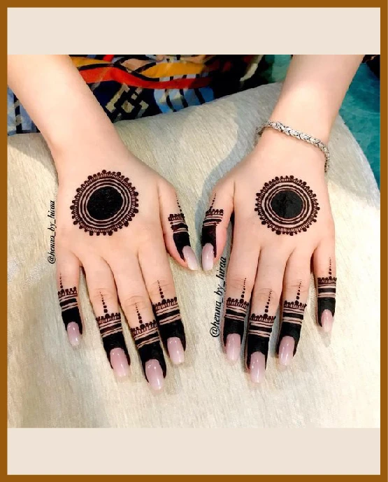 Khafif back hand mehndi design with circular mandala centerpiece