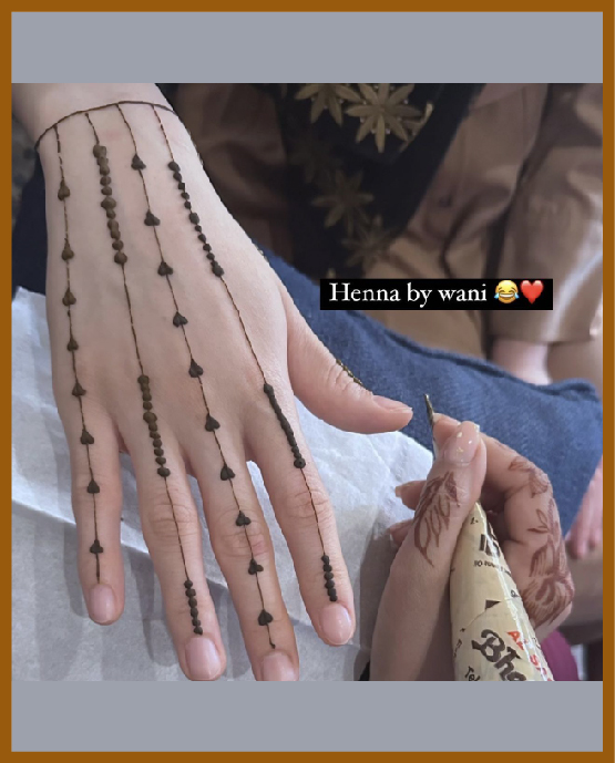 Artistic chaims of heart in simple back hand mehndi Artistic chaims of heart in simple back hand mehndi