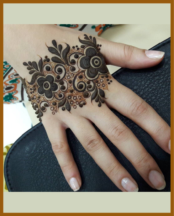 Bold elements in simple back hand mehndi Bold elements in simple back hand mehndi