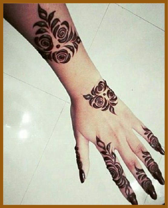 Bold lined simple back hand mehndi with net shade Bold lined simple back hand mehndi with net shade