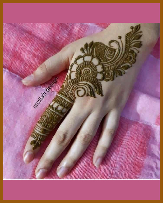 Elegant simple back hand mehndi with floral net Elegant simple back hand mehndi with floral net