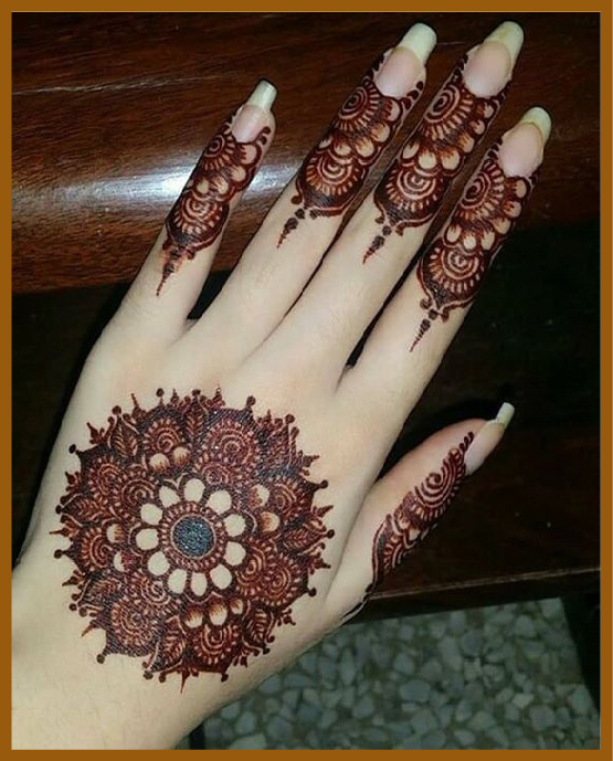 Mandala-based finger simple back hand mehndi idea Mandala-based finger simple back hand mehndi idea