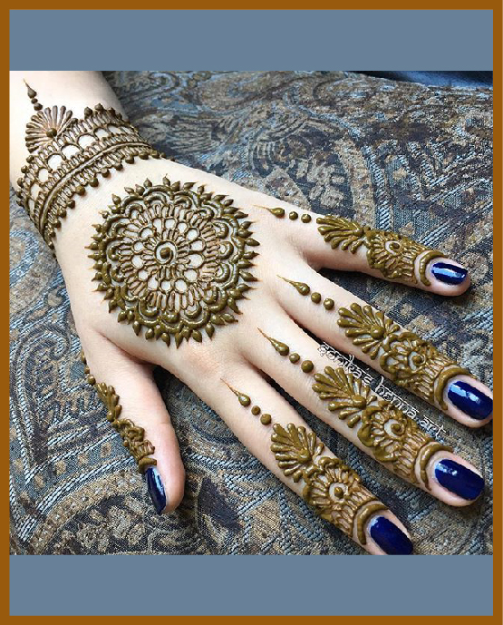 Petal-filled mandala for simple back hand mehndi Petal-filled mandala for simple back hand mehndi