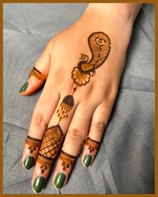 Simple back hand mehndi design with peacock style Simple back hand mehndi design with peacock style