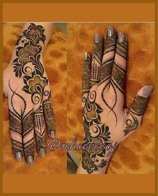 Bold stylish back hand mehndi with arabic touch Bold stylish back hand mehndi with arabic touch