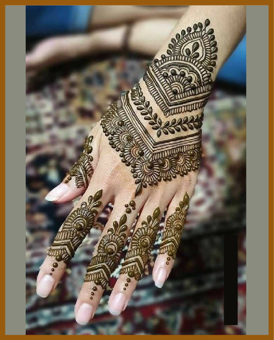 Elegant stylish back hand mehndi with leafy vines Elegant stylish back hand mehndi with leafy vines