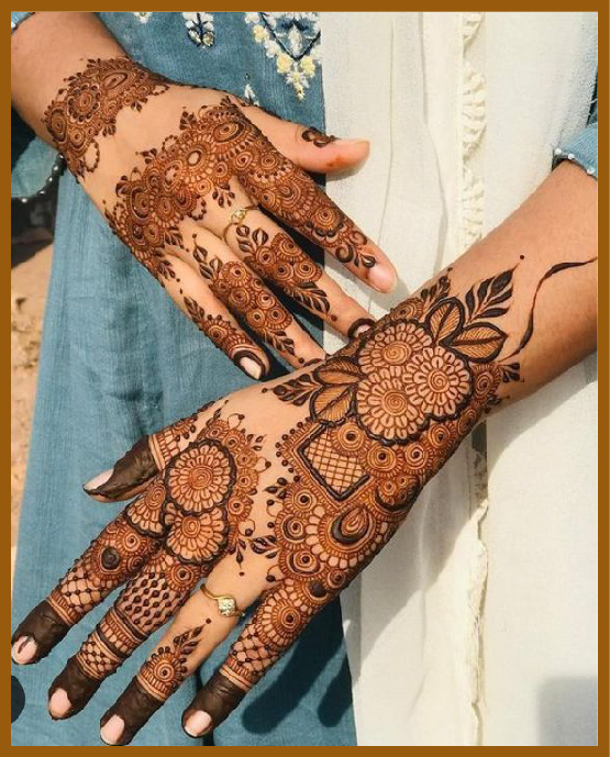 Geometric stylish back hand mehndi design with flowers and petals Geometric stylish back hand mehndi design with flowers and petals