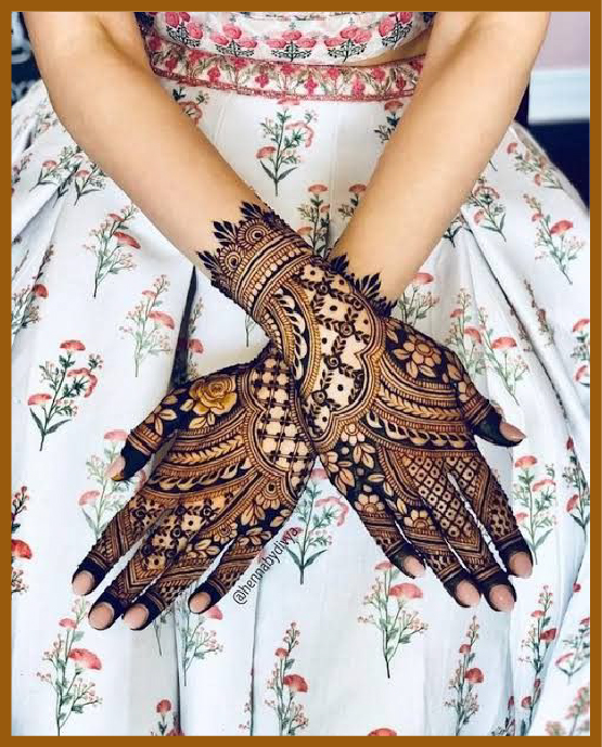 Rose pattern included in stylish back hand mehndi Rose pattern included in stylish back hand mehndi