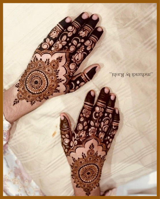 Stylish back hand flower pattern mehndi design with mandala Stylish back hand flower pattern mehndi design with mandala