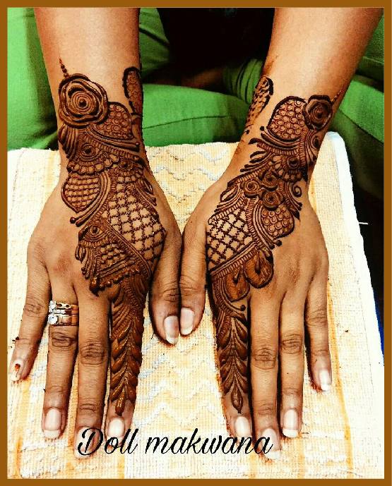 Stylish back hand mehndi art with netted pattern from one finger Stylish back hand mehndi art with netted pattern from one finger