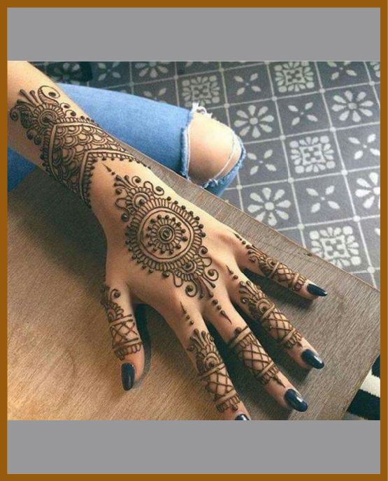 Stylish back hand mehndi design bracelet with floral extension Stylish back hand mehndi design bracelet with floral extension
