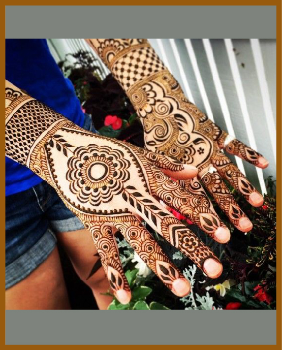 Stylish back hand mehndi design with delicate floral pattern Stylish back hand mehndi design with delicate floral pattern