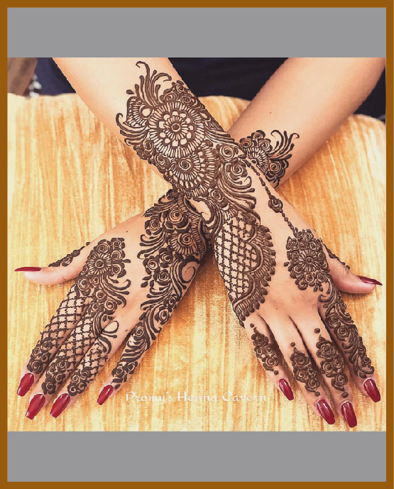 Stylish back hand mehndi layout with ornamental detailing Stylish back hand mehndi layout with ornamental detailing