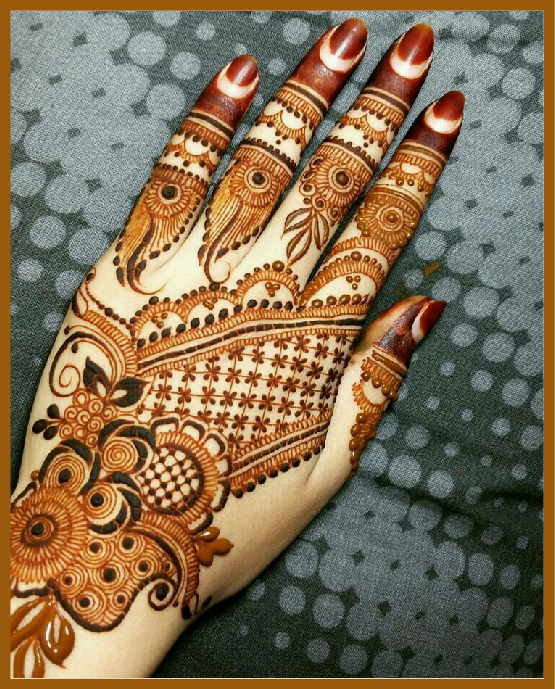 Stylish back hand mehndi with shaded rose petals Stylish back hand mehndi with shaded rose petals