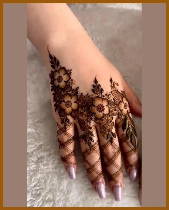 Aesthetic back hand mehndi design with trail ending on fingers Aesthetic back hand mehndi design with trail ending on fingers