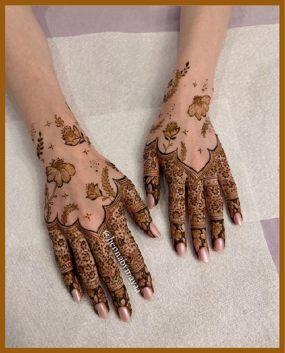 Aesthetic back hand mehndi with detailed flower vines Aesthetic back hand mehndi with detailed flower vines