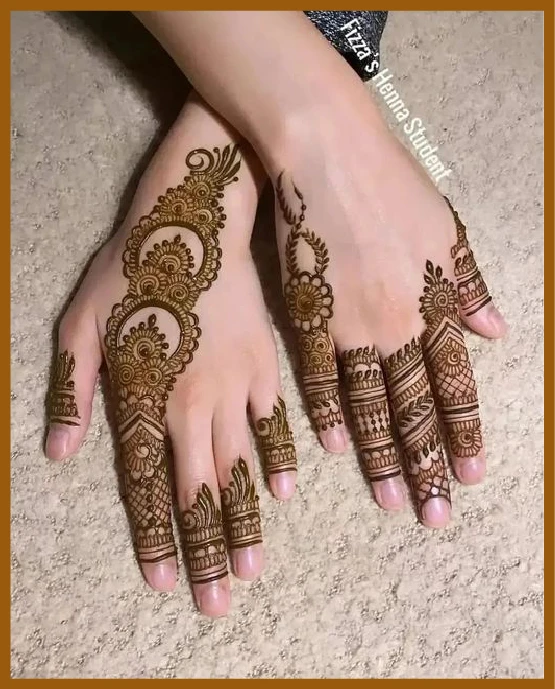 Aesthetic back hand mehndi with half-and-half look Aesthetic back hand mehndi with half-and-half look