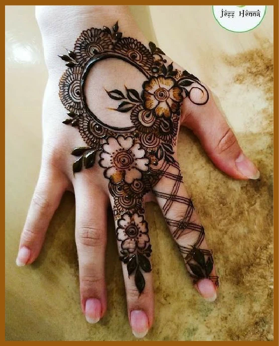 Aesthetic back hand mehndi with lotus flower art Aesthetic back hand mehndi with lotus flower art