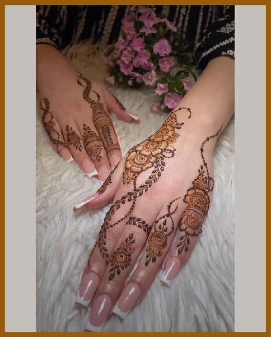 Crossline and leaf trail aesthetic back hand mehndi design Crossline and leaf trail aesthetic back hand mehndi design
