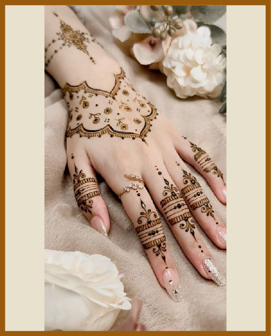 Designer aesthetic back hand mehndi in floral trail Designer aesthetic back hand mehndi in floral trail