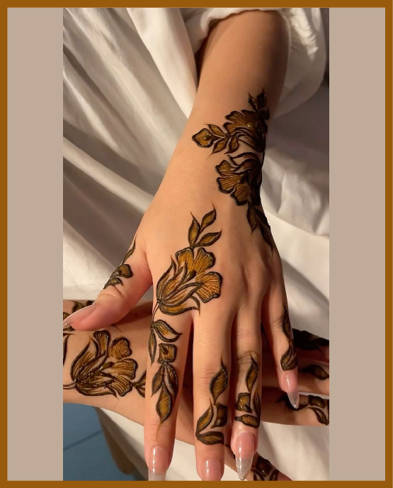 Light aesthetic floral back hand mehndi for elegant look Light aesthetic floral back hand mehndi for elegant look