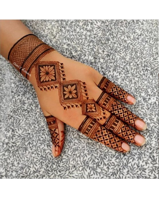 Cultural Swirl With Hatch Covering Back Hand Mehndi Design Cultural Swirl With Hatch Covering Back Hand Mehndi Design