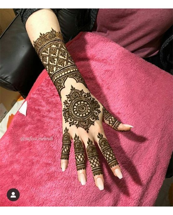 Whimsical Petal With Peacock Along Back Hand Mehndi Design Whimsical Petal With Peacock Along Back Hand Mehndi Design