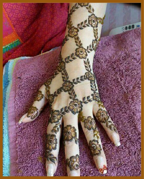 Artistic flowers chain elements in modern back hand mehndi design Artistic flowers chain elements in modern back hand mehndi design
