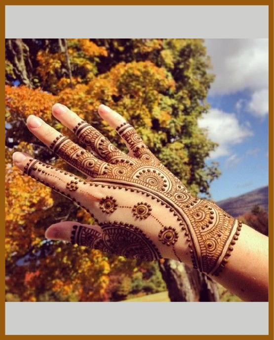 Artistic lined flowers in modern back hand mehndi design Artistic lined flowers in modern back hand mehndi design
