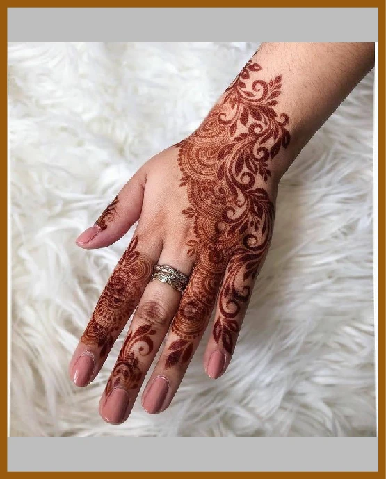 Artistic lines and loops in modern back hand mehndi design Artistic lines and loops in modern back hand mehndi design