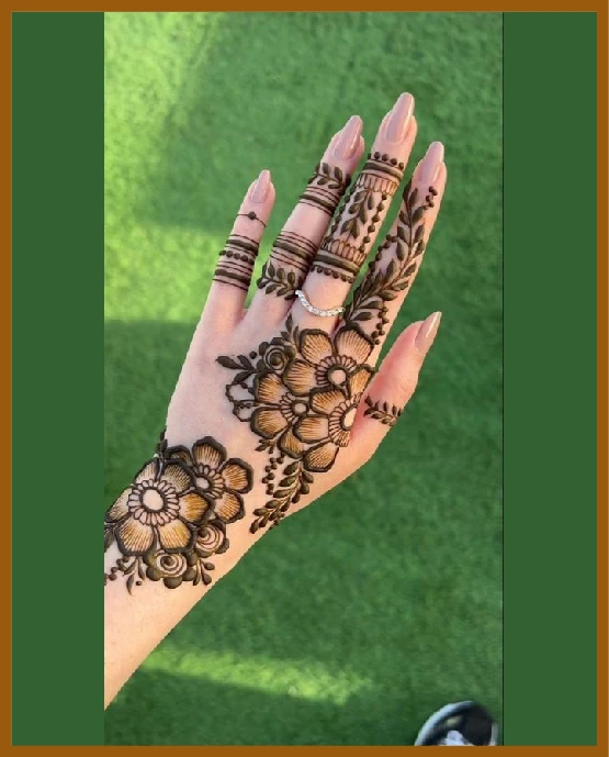 Leafy lines forming a modern back hand mehndi design Leafy lines forming a modern back hand mehndi design