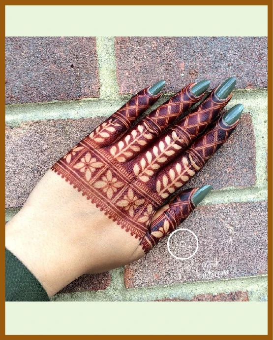 Lined square netting in modern back hand mehndi design Lined square netting in modern back hand mehndi design