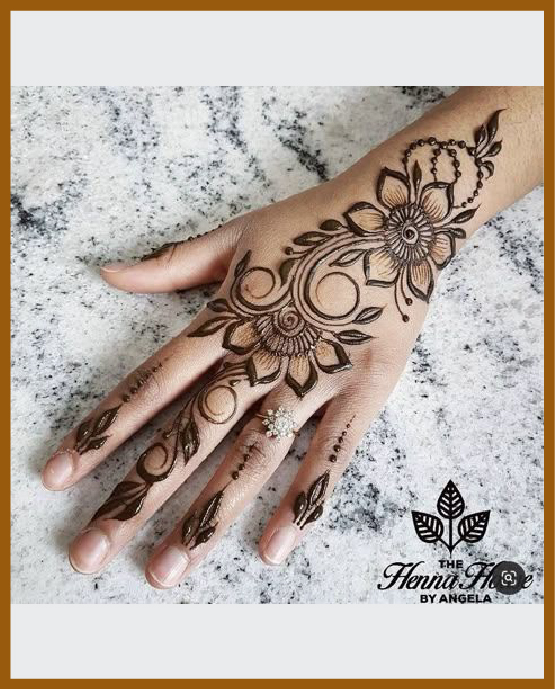 Modern back hand mehndi design with bold strokes hooks Modern back hand mehndi design with bold strokes hooks