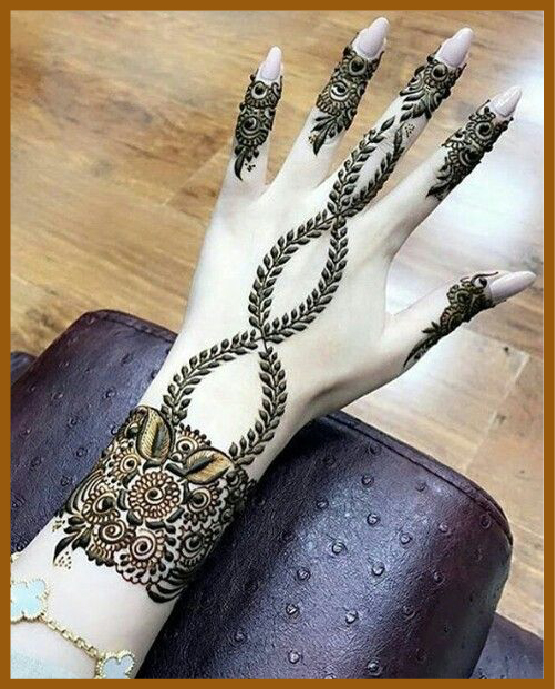 Stylish curves and chains in modern back hand mehndi design Stylish curves and chains in modern back hand mehndi design