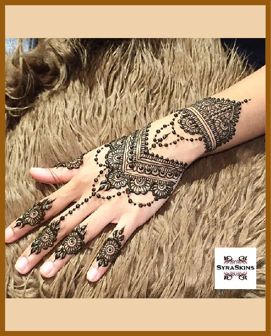 Stylish curves with dots in modern back hand mehndi design Stylish curves with dots in modern back hand mehndi design