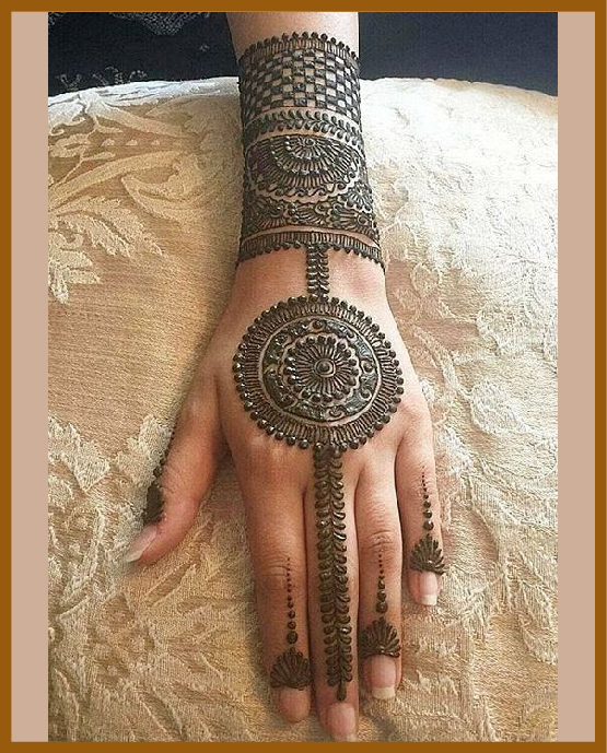 Wrist cuff chain inspired modern back hand mehndi design Wrist cuff chain inspired modern back hand mehndi design