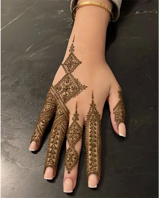 Festive Bracelet With Rose Featuring Stylish Finger Mehndi Design