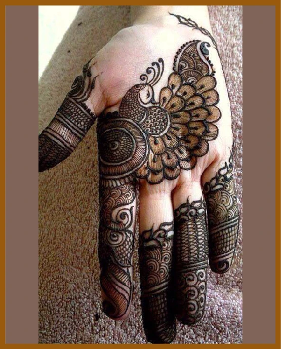 Aesthetic front hand mehndi design with peacock pattern Aesthetic front hand mehndi design with peacock pattern
