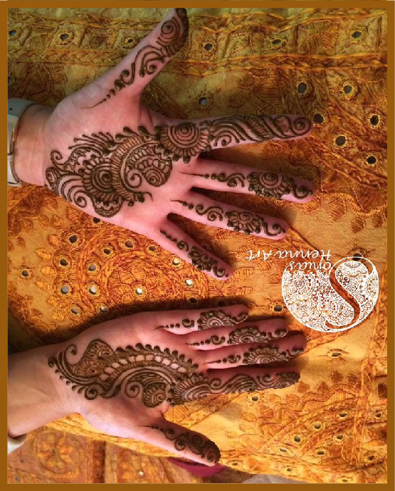 Minimal front hand mehndi design using leafy rings Minimal front hand mehndi design using leafy rings