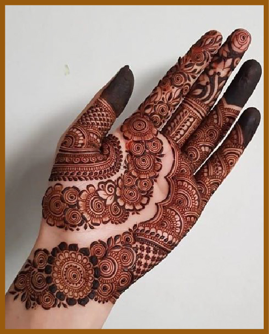 Full-hand royal front hand mehndi design with ornamental swirls Full-hand royal front hand mehndi design with ornamental swirls