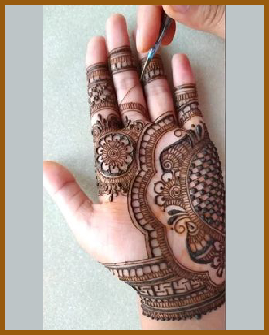 Royal front hand mehndi design featuring heavy paisley fills Royal front hand mehndi design featuring heavy paisley fills