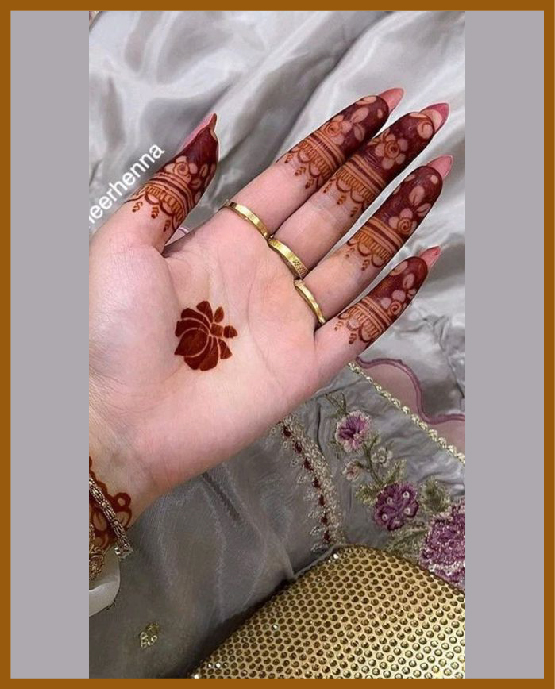 Petal mandala with tips in simple front hand mehndi design Petal mandala with tips in simple front hand mehndi design