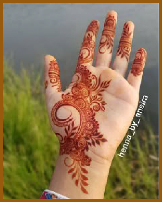 Simple front hand mehndi design featuring curved leafy lines Simple front hand mehndi design featuring curved leafy lines