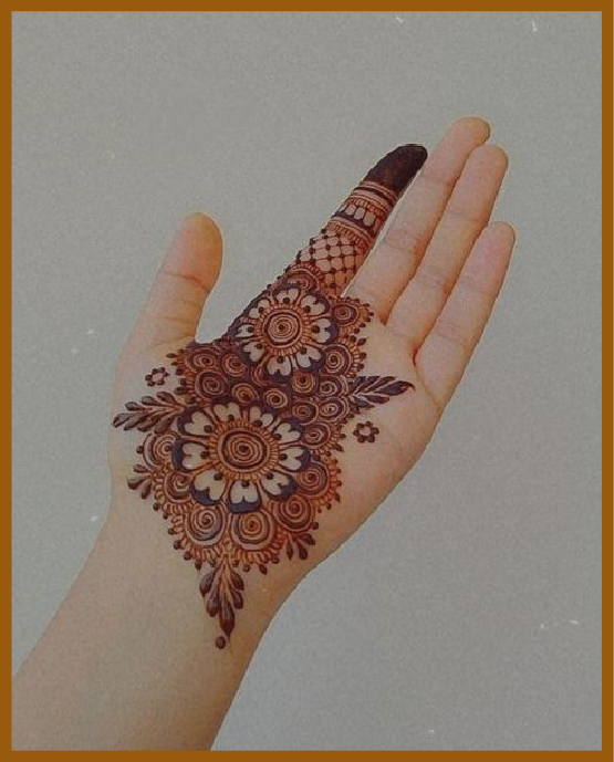 Simple front hand mehndi design with leafy finger detail Simple front hand mehndi design with leafy finger detail