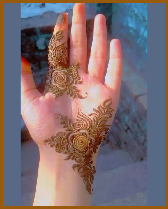 Simple front hand mehndi design with scattered flowers Simple front hand mehndi design with scattered flowers