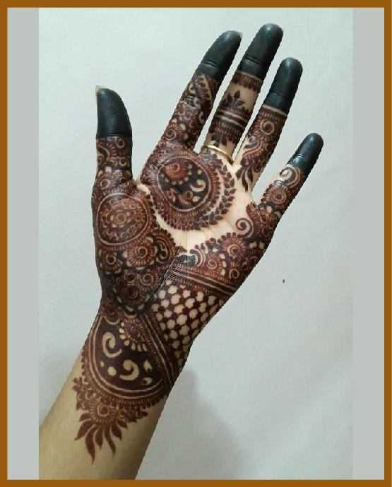 Circle lines and flowers in stylish front hand mehndi design Circle lines and flowers in stylish front hand mehndi design