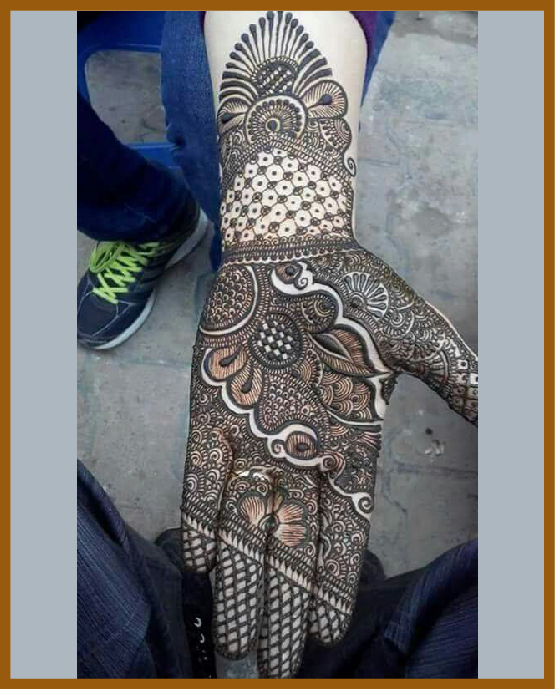 Stylish front hand mehndi design with asymmetric flower pattern Stylish front hand mehndi design with asymmetric flower pattern